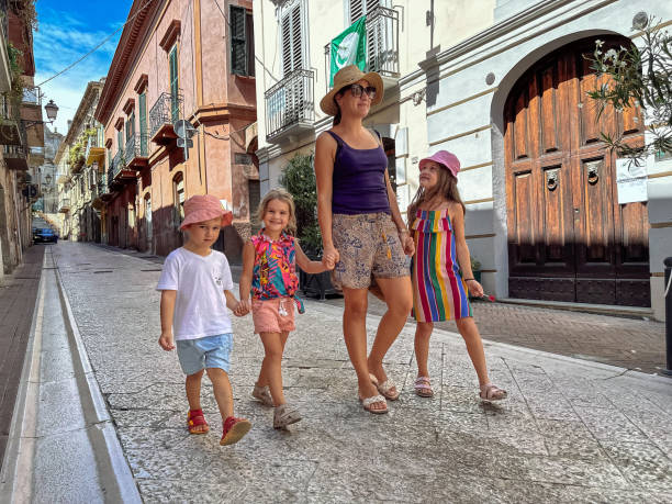istock Mother with kids visiting old town 2166651650
