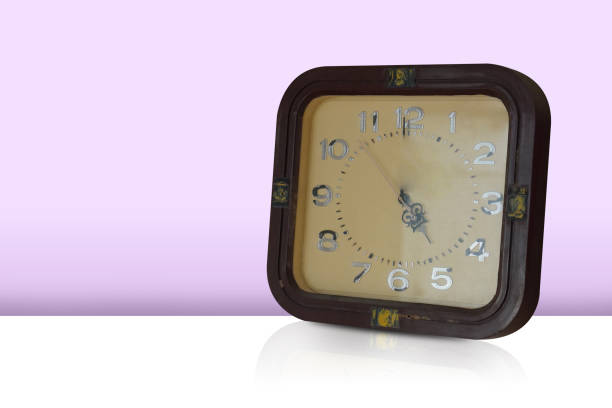 istock antique brown wooden wall clock, square shape, placed on a gradient pink and purple background, object, decor, decoration, banner, template, fashion, copy space 2166652477