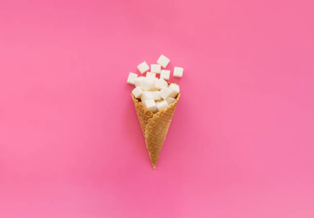 istock white sugar cubes in a waffle ice cream cone 2166654118