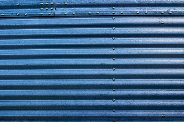 istock Blue steel siding with rivets industrial looking background 2166656573