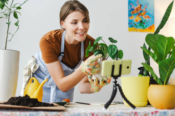 istock Gardener influencer creating content for her social media channel using smartphone 2166657957