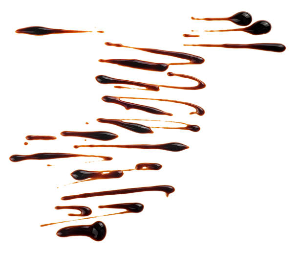 istock Hot melted chocolate isolated on a white background, top view. Chocolate syrup. Splashes of sweet chocolate sauce. 2166659276