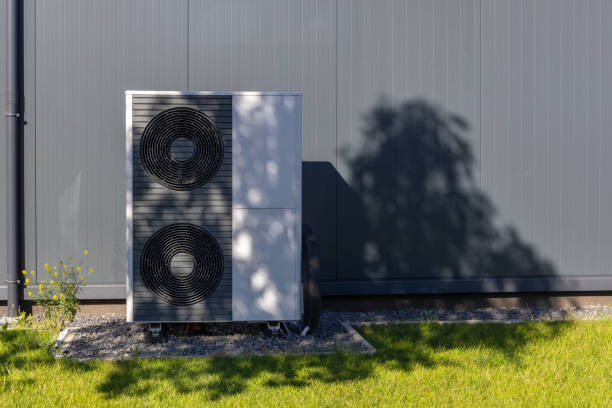 istock Modern Heat Pump Unit Against Gray Building Exterior 2166660650