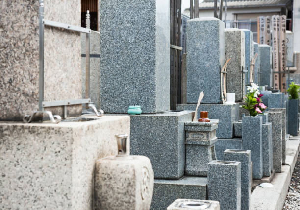 A spring cemetery rich in nature. A scene of blue skies and rows of tombstones.