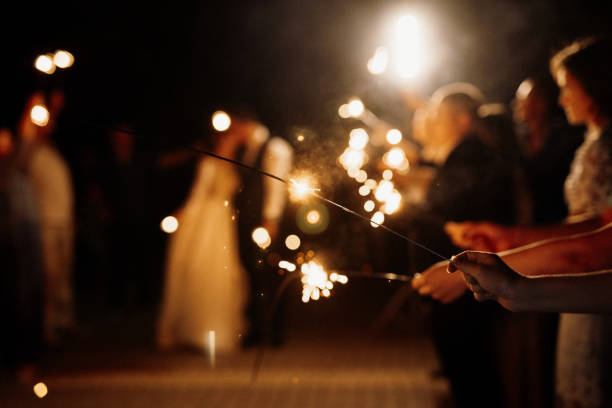 istock newlyweds at a wedding of sparklers 2166667904