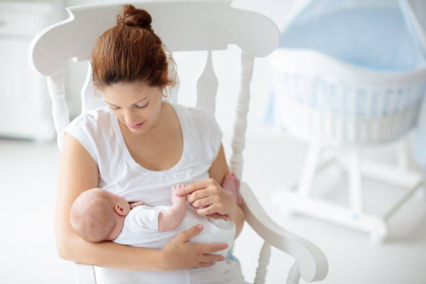 istock Young mother with newborn baby. 2166668103