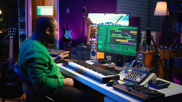 istock Sound engineer recording piano notes with DAW software in his home studio 2166668142
