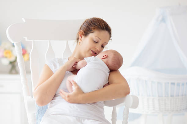 istock Young mother with newborn baby. 2166668154