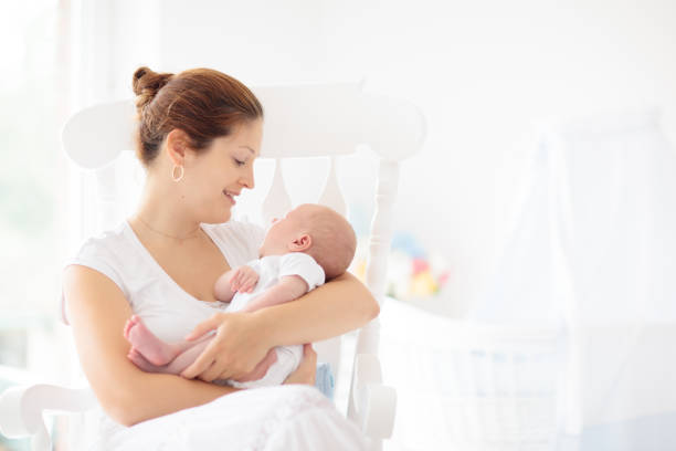 istock Young mother with newborn baby. 2166668164