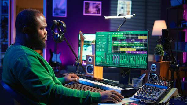 istock Songwriter mixing and mastering tracks on stereo console 2166668222