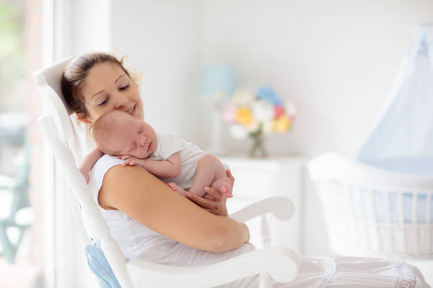 istock Young mother with newborn baby. 2166668236