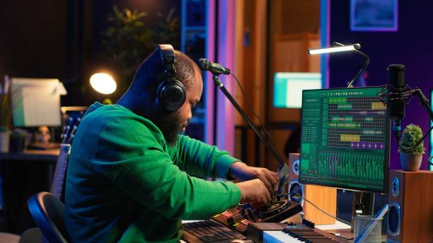 istock Sound engineer mixing and mastering new music on console and daw software 2166668710