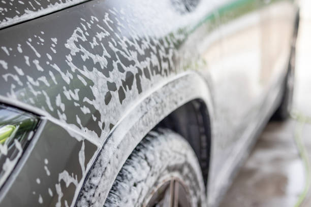 istock car cleaning and washing with foam soap 2166675373