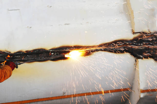istock Cutting old metal product with fire. 2166676023