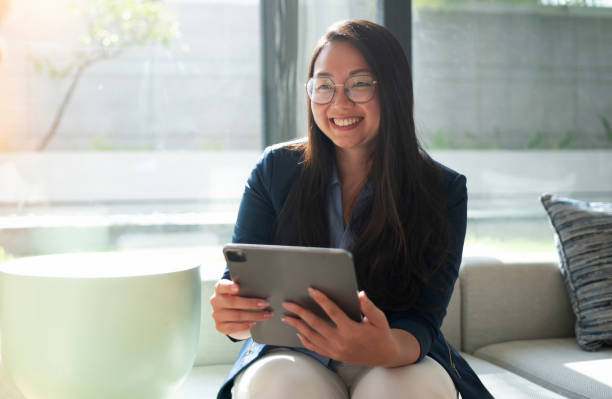 istock Happy real estate agent smiling while showing a house 2166679572