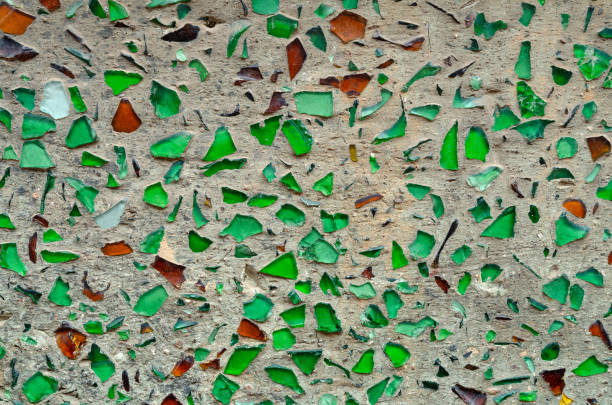 The texture of the green broken glass mud wall