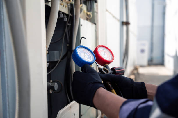 istock Air conditioning, HVAC service technician using gauges to check refrigerant and add refrigerant,Air Conditioning Repair, repairman on the floor fixing air conditioning system. 2166685581