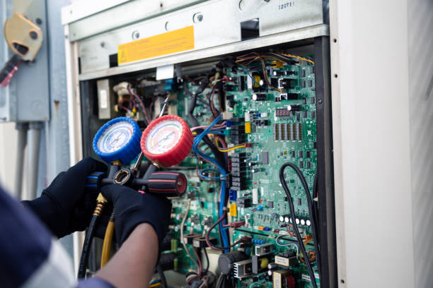 istock Air conditioning, HVAC service technician using gauges to check refrigerant and add refrigerant,Air Conditioning Repair, repairman on the floor fixing air conditioning system. 2166685583