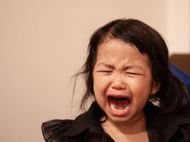 istock Crying asian toddler expressing strong emotions indoors 2166692958