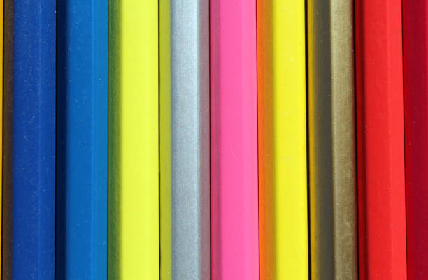 istock Row of vibrant colored pencils abstract textured background 2166697309