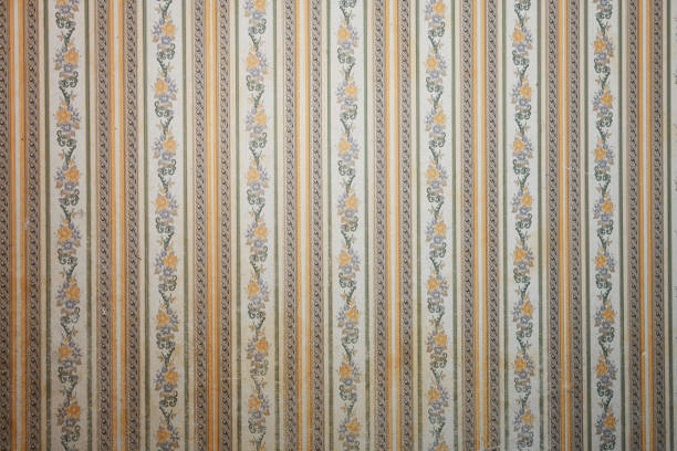 istock Old wallpaper on the wall. Old wallpaper for texture or background. 2166698702