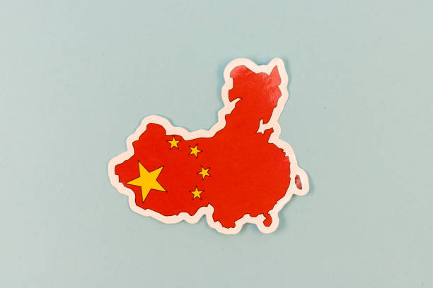 China Map with National Flag Sticker on Light Blue Background with Copy Space.