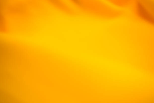 istock Yellow background blur cloth fabric orange color gradient texture pattern silk wave banner gold, fashion material backdrop poster for summer tropical travel holidays, satin mockup luxury 2166701288