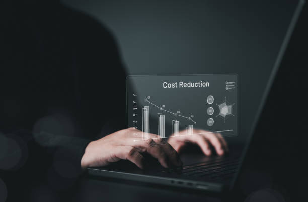 istock Cost reduction management, business lean optimization manufacturing. Decreasing company expenses to maximize profits. People use computer to analyze enterprise financial data for long-term investment. 2166706013