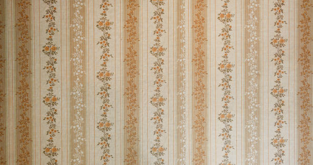 istock Old wallpaper on the wall. Old wallpaper for texture or background. 2166707270
