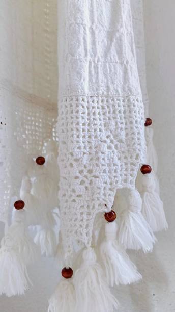 istock cream colored curtain with lace and beads 2166709228
