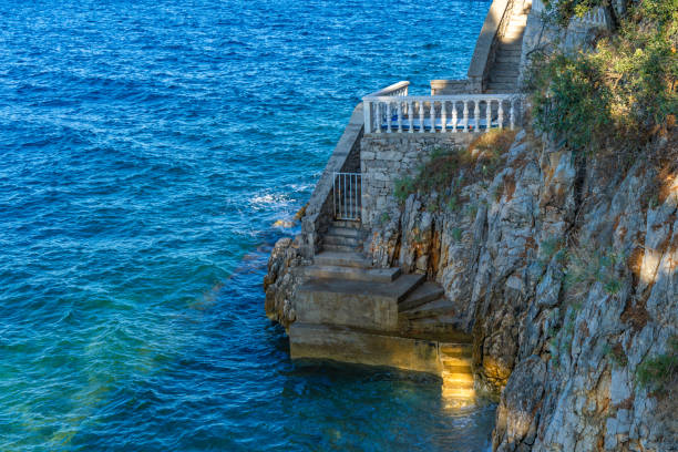 istock Dangerous descent down steep stairs to a small beach 2166710520