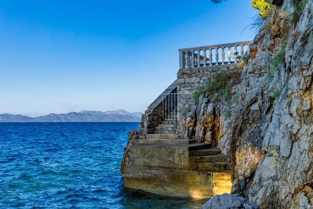 istock Dangerous descent down steep stairs to a small beach 2166710521