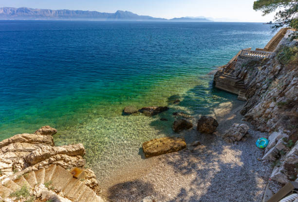 istock Dangerous descent down steep stairs to a small beach 2166710549