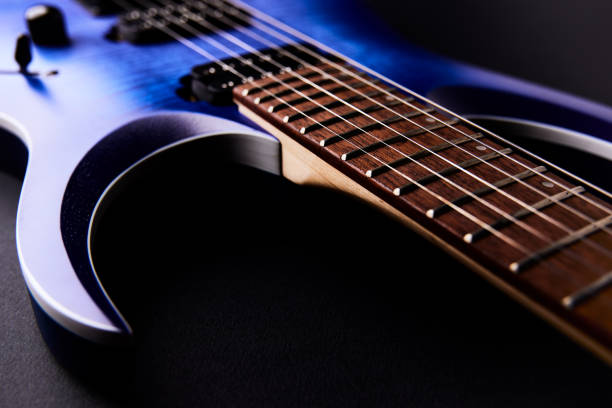 Fretboard of modern electric guitar. Close up.