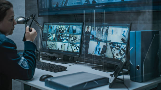 istock Female dispatch or CCTV operator works on computer in monitoring center 2166715698