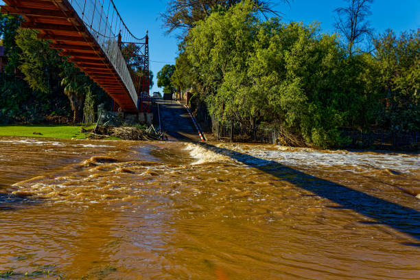 istock Flooded river crossing in residential area 2166716626