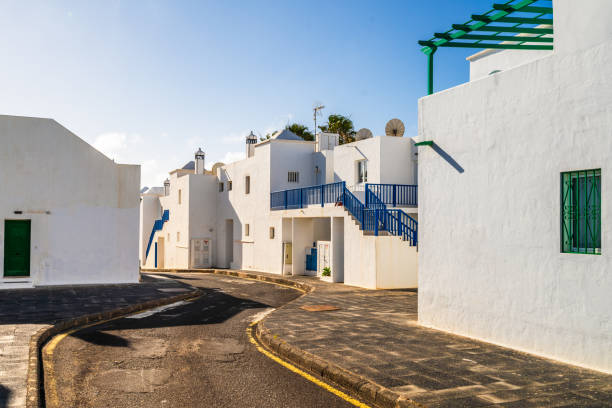 Picturesque whitewashed architecture with green elements in Costa Teguise, Lanzarote, Canary Islands, Spain