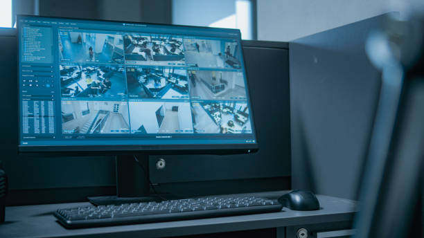 istock Workplace for security guard with computer monitor showing surveillance footage 2166717425
