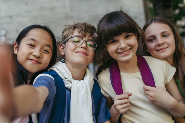 istock Four friends taking selfie outdoor. 2166719738