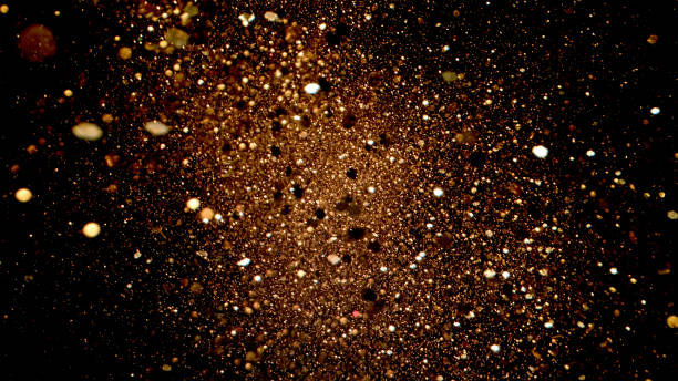 istock Golden Particle Explosion on Black Background 2166722201
