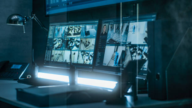istock Surveillance footage from security cameras with face recognition on computer monitors 2166722958