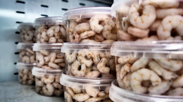 istock Many peeled shrimps in brine on a fridge shelf 2166725558