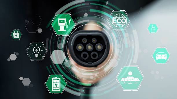 istock Focus EV charger pointing in front of camera with hologram. Peruse 2166725847