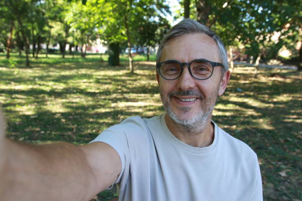 istock Lifestyle of senior man in public park using technology 2166726085
