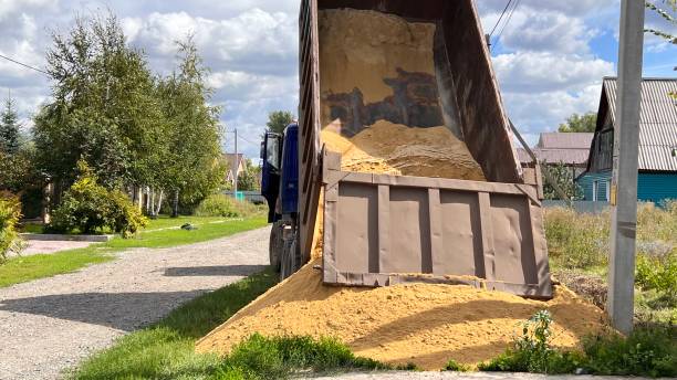 istock A truck brought sand for the construction site. Bulk cargo delivery. unloading process 2166727252