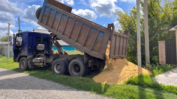 istock A truck brought sand for the construction site. Bulk cargo delivery. unloading process 2166727292
