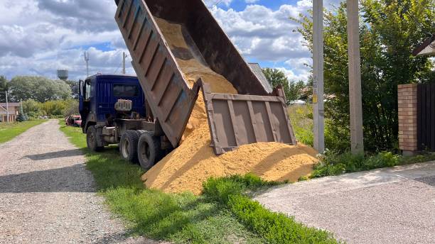 istock A truck brought sand for the construction site. Bulk cargo delivery. unloading process 2166727294