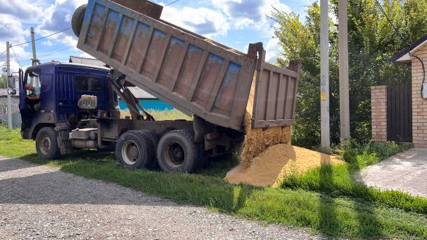 istock A truck brought sand for the construction site. Bulk cargo delivery. unloading process 2166727324