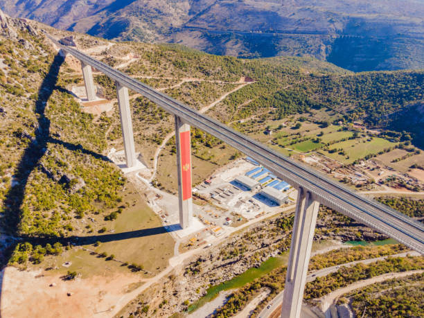 Montenegro. Bridge Moracica. Reinforced concrete bridge across the Moraci gorge. The motorway Bar - Bolyare. The bridge is on the Smokovac - Uvach - Mateshevo section. The Moracica Bridge was built by the China Road and Bridge Corporation. montenegro. bridge moracica. reinforced concrete bridge across the moraci gorge. the motorway bar - bolyare. the bridge is on the smokovac - uvach - mateshevo section. the moracica bridge was built by the china road and bridge corporation