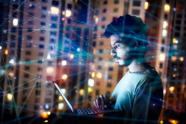 istock Man with Laptop Surrounded by Digital Connections 2166729043